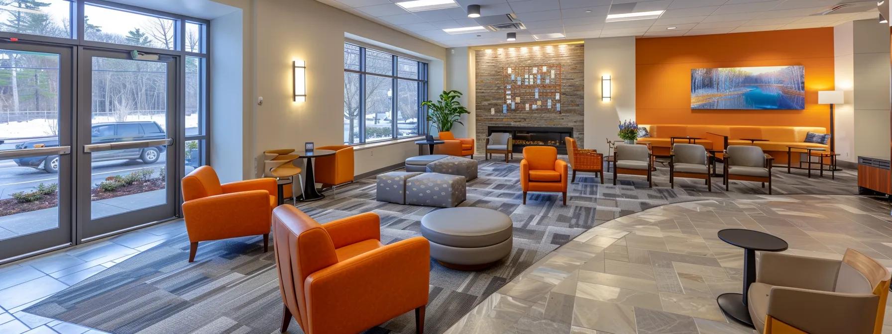 a bright and inviting addiction treatment center in massachusetts showcases a welcoming interior, featuring modern furnishings and cozy communal spaces designed to promote comfort and recovery for individuals seeking aftercare support.