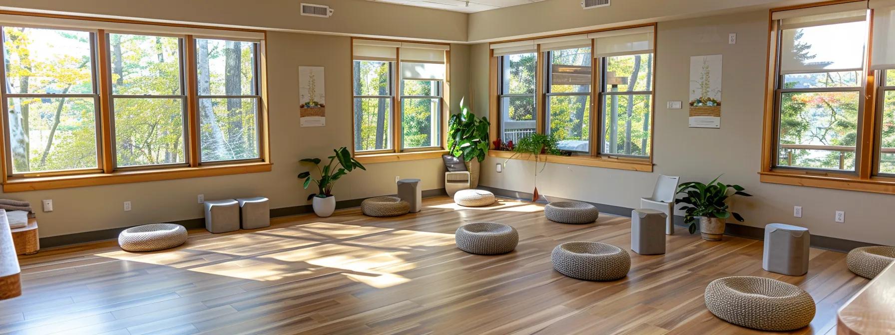 a modern, well-designed therapy center in massachusetts showcases a bright, inviting common area filled with comfortable seating and motivational artwork, emphasizing the balanced commitment required for half day iop programs alongside the immersive environment of full day treatment programs. a modern, well-designed therapy center in massachusetts showcases a bright, inviting common area filled with comfortable seating and motivational artwork, emphasizing the balanced commitment required for half day iop programs alongside the immersive environment of full day treatment programs.