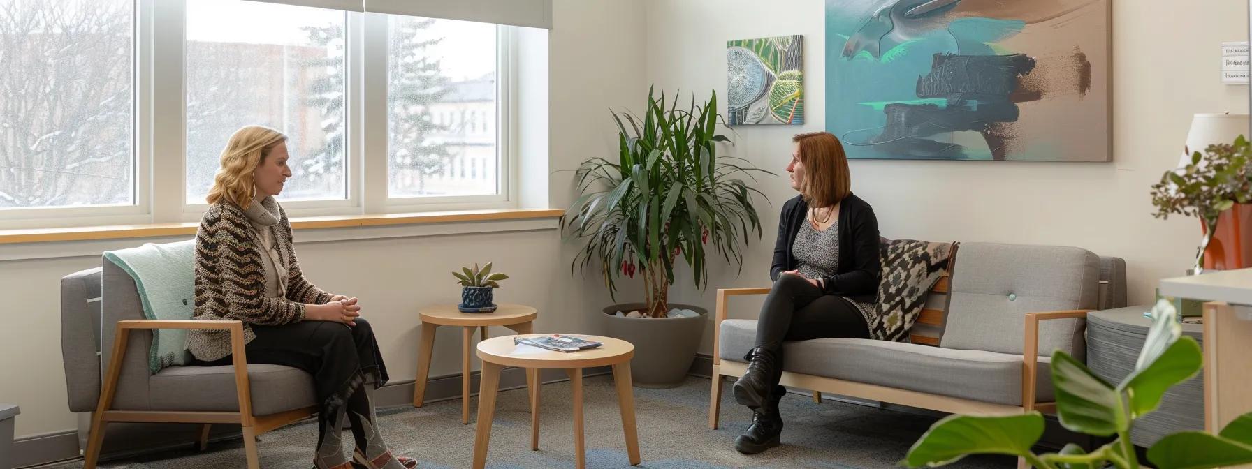 a sleek, modern office space in massachusetts features therapists engaged in collaborative discussions, surrounded by uplifting artwork and comfortable seating, embodying the clinical benefits and supportive atmosphere of a half-day intensive outpatient program.