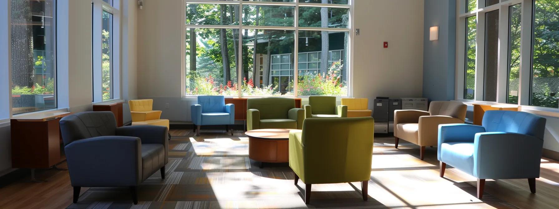 a thoughtfully designed, modern counseling office in massachusetts, featuring inviting seating and a calming ambiance, where individuals engage in self-assessment discussions about their mental health recovery goals related to a half-day intensive outpatient program.